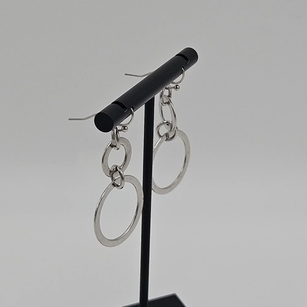 silver tone graduated dangle earrings
